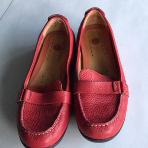 Structured by Clark’s red loafers.